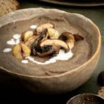 A bowl of creamy mushroom and chestnut soup ready to eat.