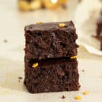 Two vegan mince pie brownies stacked on top of each other.