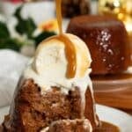 Sticky toffee pudding with toffee sauce being drizzled on top.