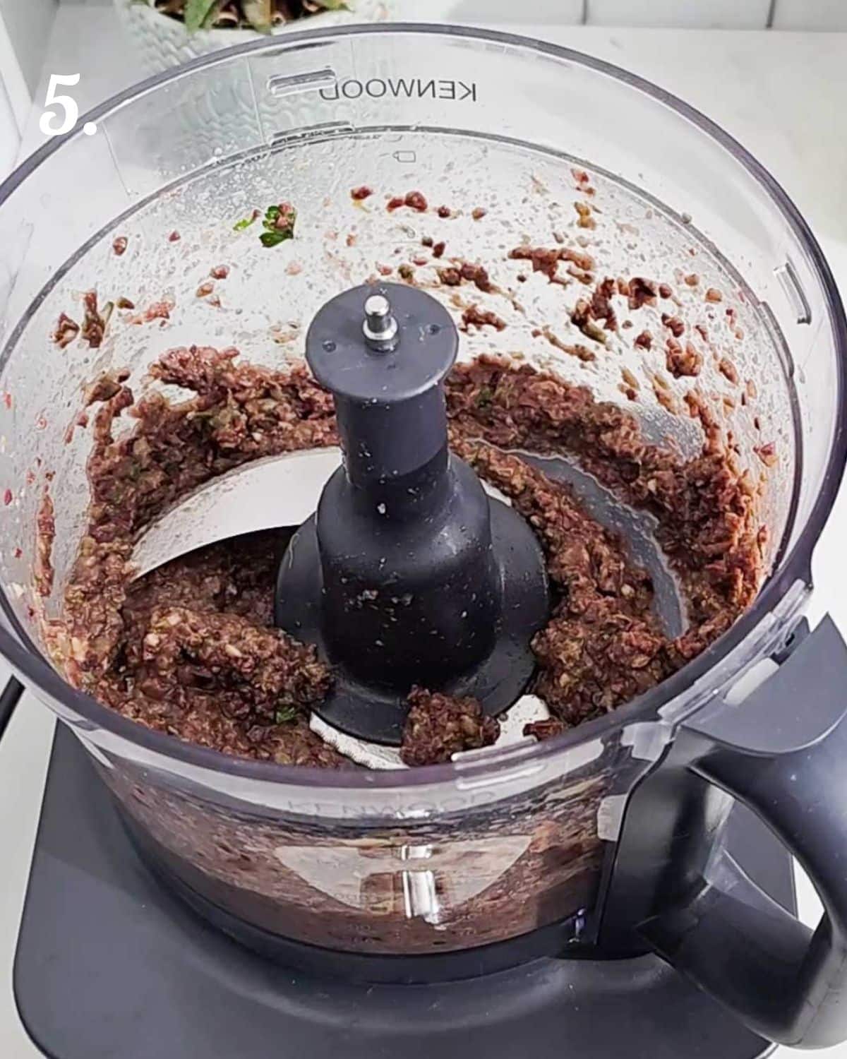 How the tapenade looks once it has finished being blended in the food processor.