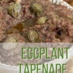 Eggplant tapenade in a little bowl ready to eat. There are some crostini around it with tapenade on them.