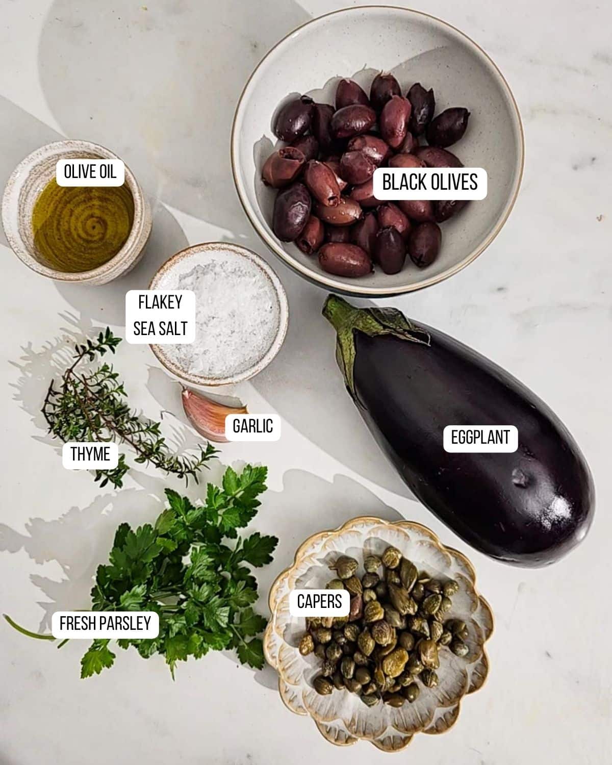 Ingredients for eggplant tapenade laid out ready to use.