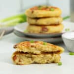 Leftover Mashed potatoes in a stack, with one opened up in front to show the fluffy interior.