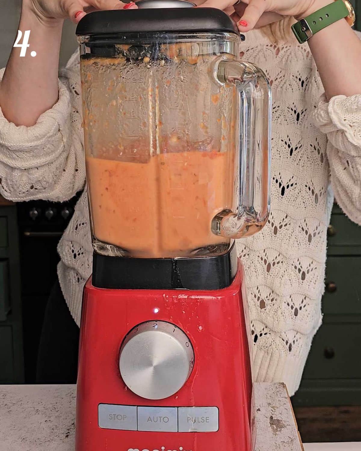 The soup being blended before being reheated to serve.