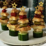 A plate of Christmas Tree Charcuterie appetizers made with puff pastry stars ready to eat.