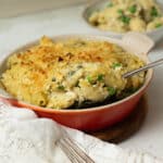 A casserole dish with vegan tuna noodle casserole in it ready to eat.