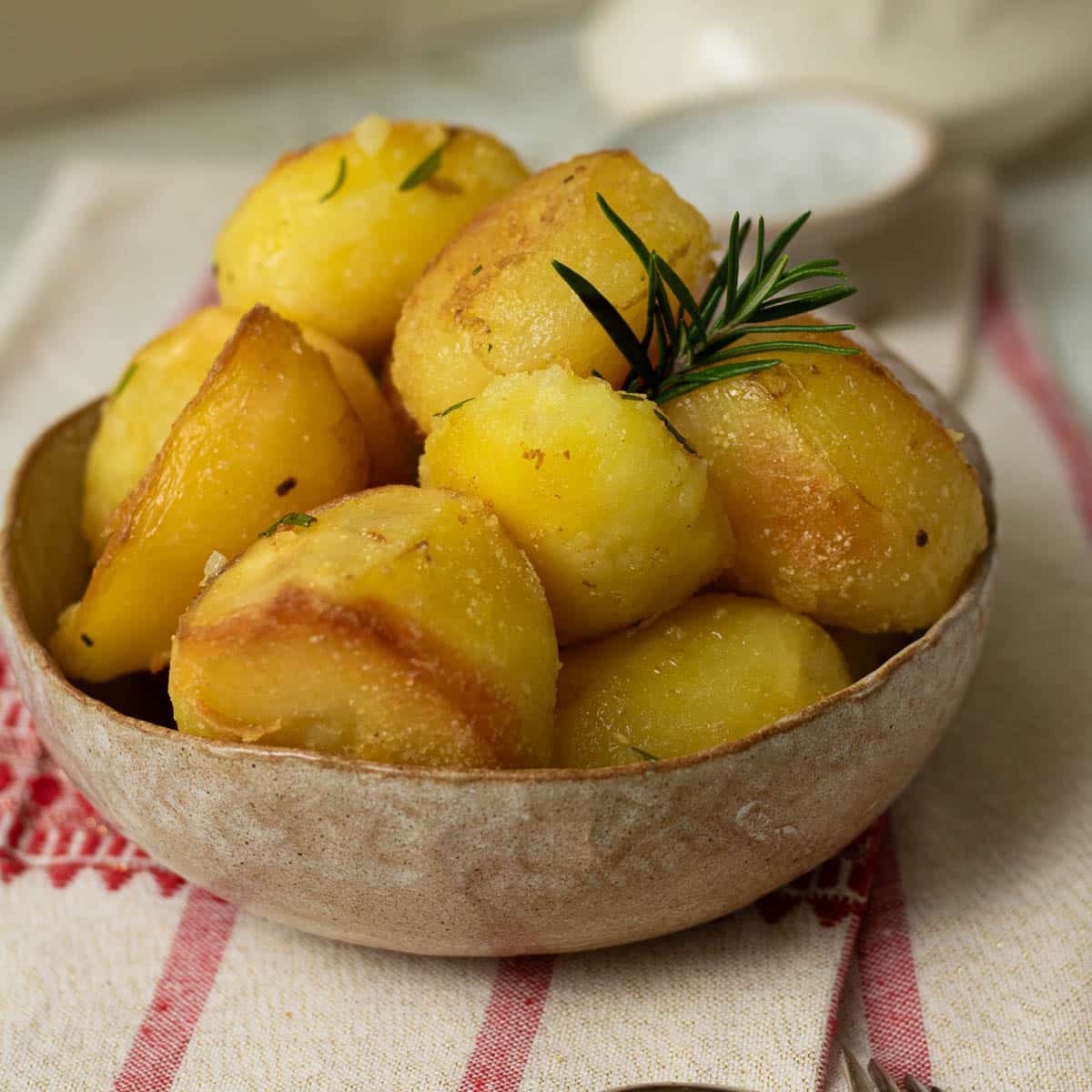 Roast potatoes ready to eat in a bowl.
