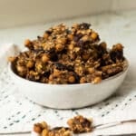 A bowl of savoury chickpea granola ready to snack on.