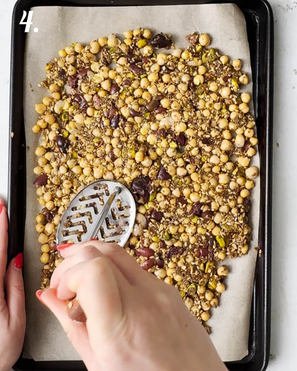 Spread the chickpea mixture onto a lined baking sheet and squash a bit with a masher to encoourage clumping. Bake for 45-50 mins.