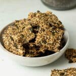 Chia and Flax seed crackers ready to eat in a bowl.