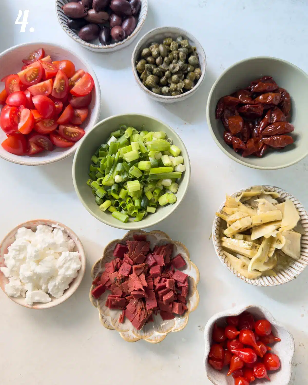 All the salad ingredients chopped up into bite size pieces ready to add to the pasta salad. 