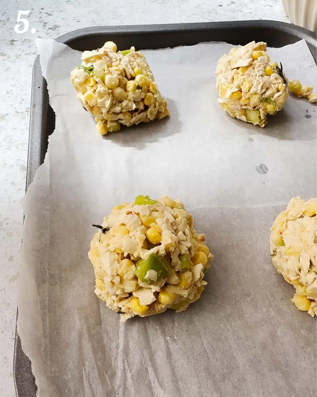 Use a cookie dough scoop to scoop out even fritter balls.