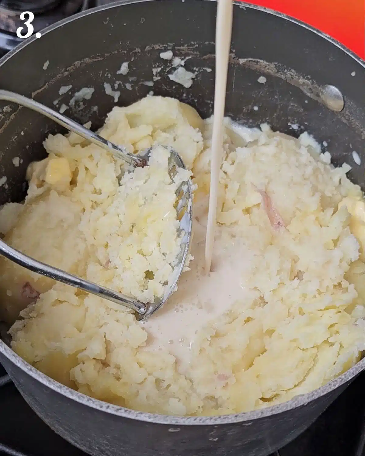 Adding in vegan milk and seasonings to the mash.