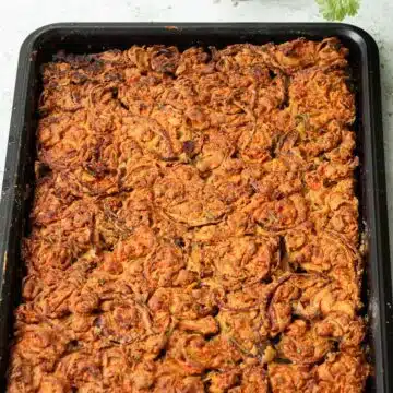 A pan of carrot and onion scarpaccia cooked and ready to eat.