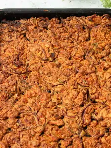 A pan of carrot and onion scarpaccia cooked and ready to eat.