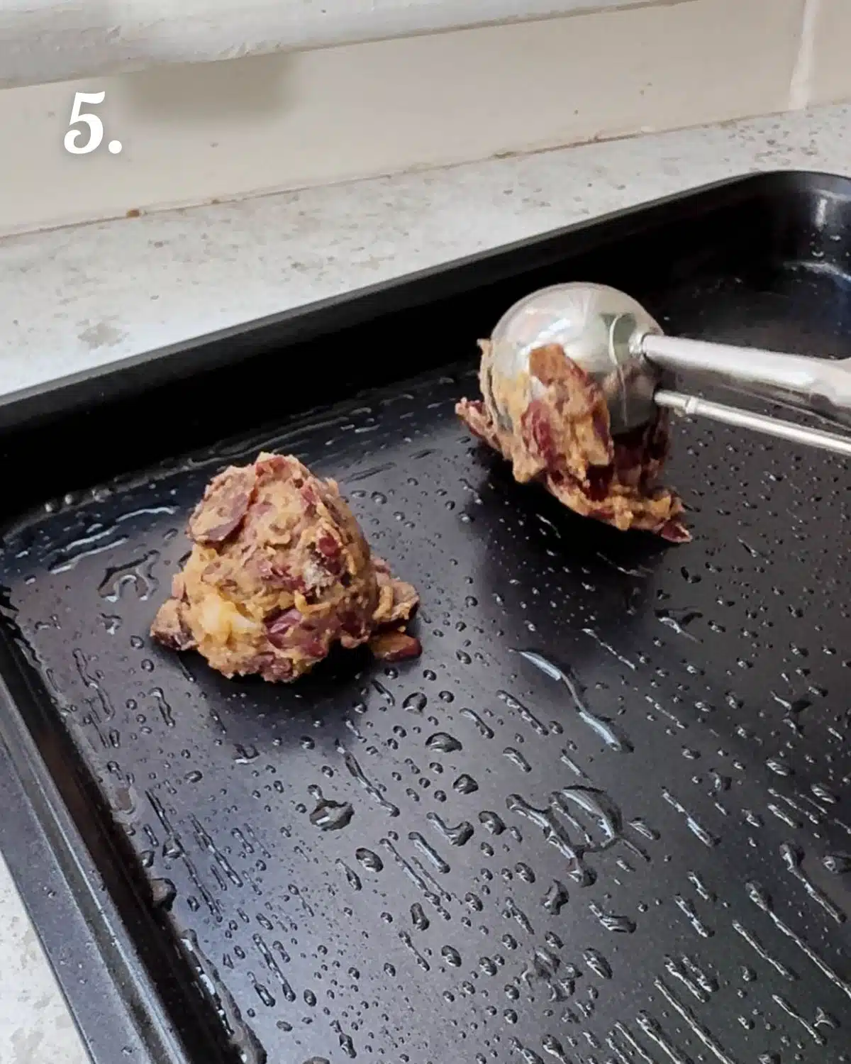 Scooping the bean balls out.