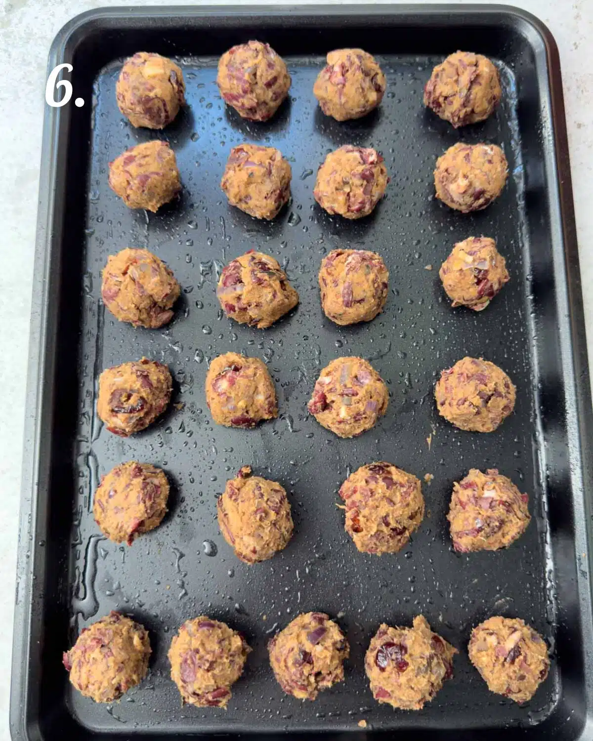 The bean balls on a tray ready to bake.