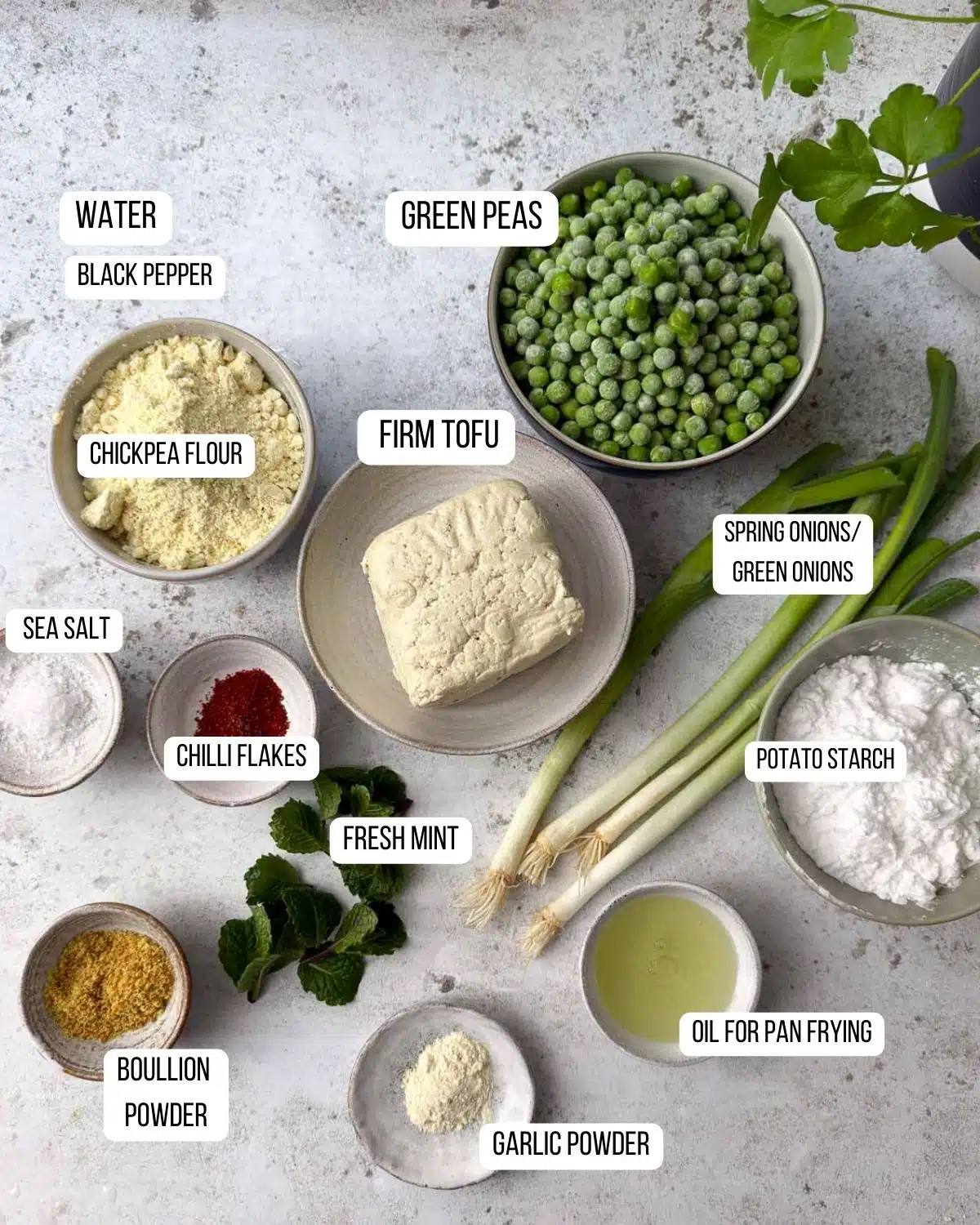 Ingredients for tofu and pea fritters laid out ready to use.