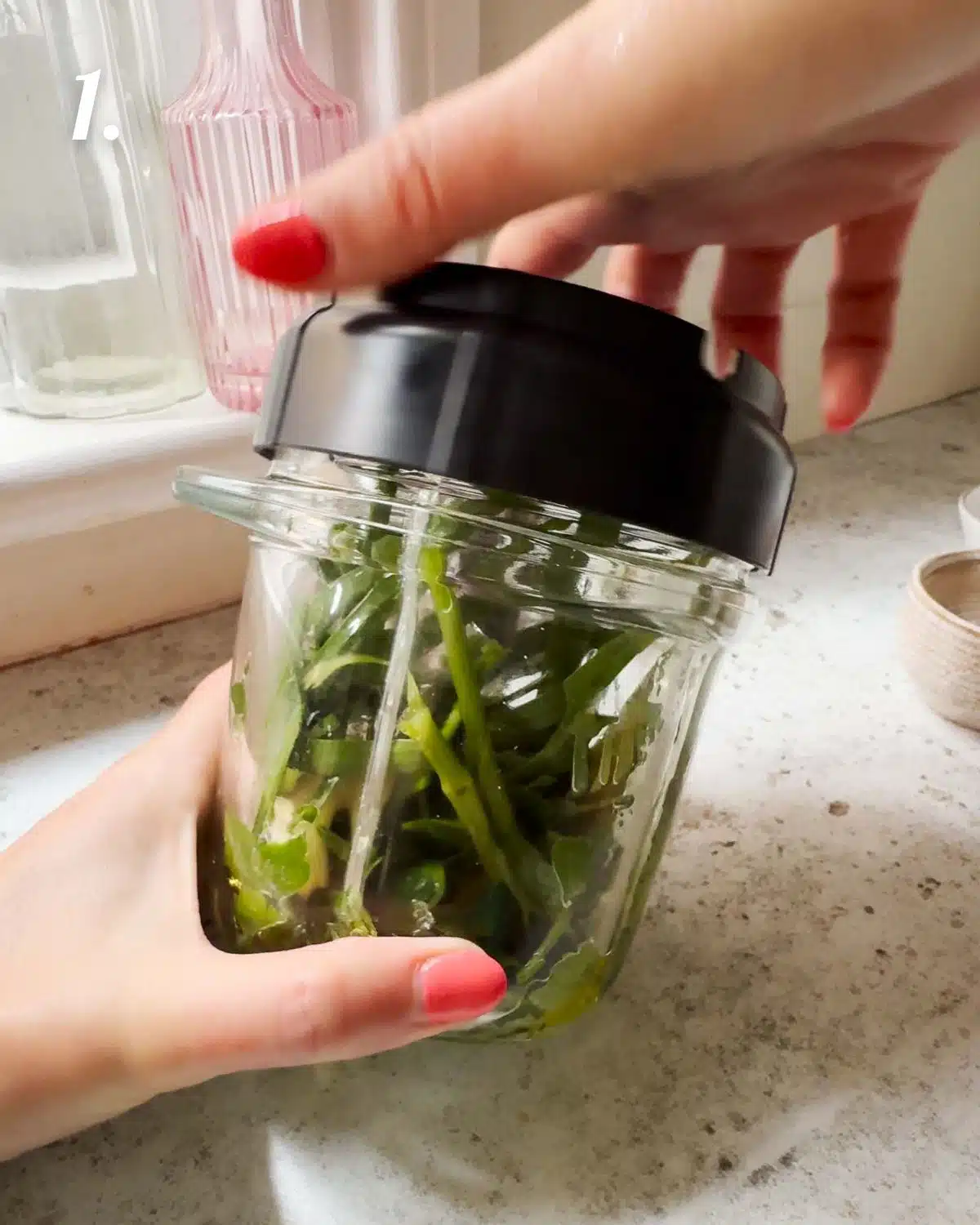Add all the ingredients for the herb oil to a high speed blender.