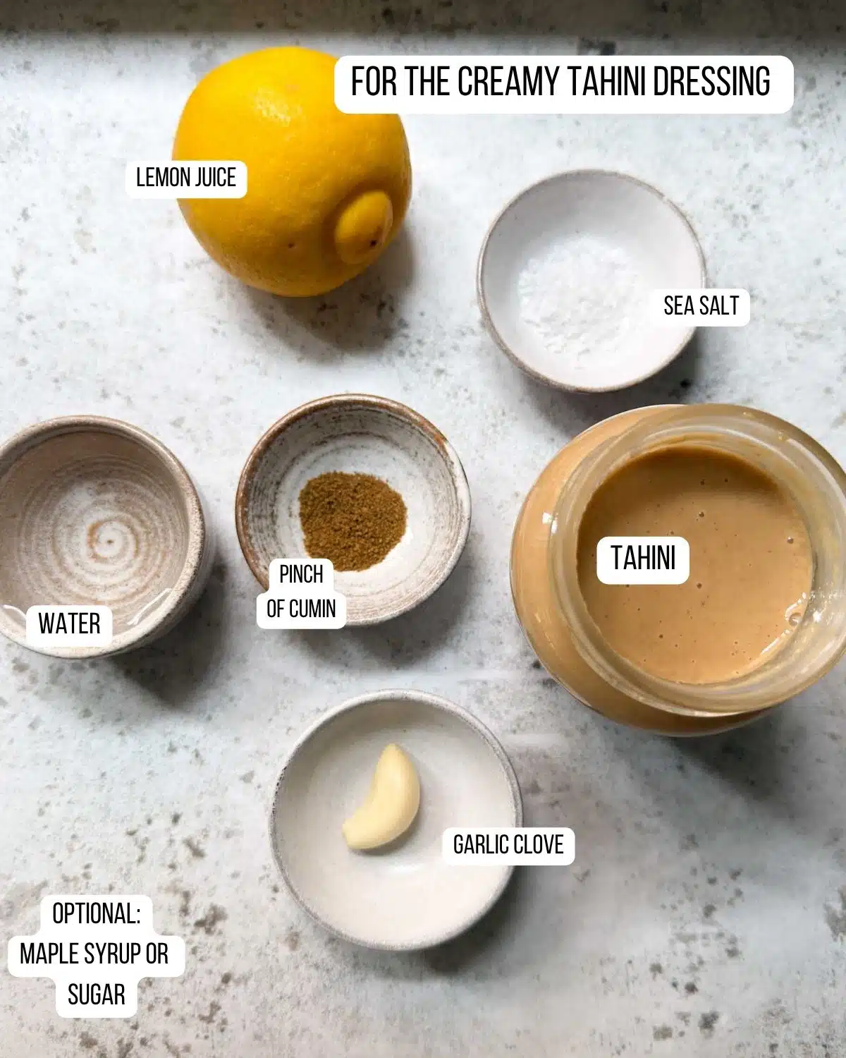 Ingredients for creamy tahini sauce laid out ready to use.