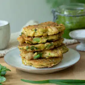 A stack of zucchini and white bean fritters ready to serve.
