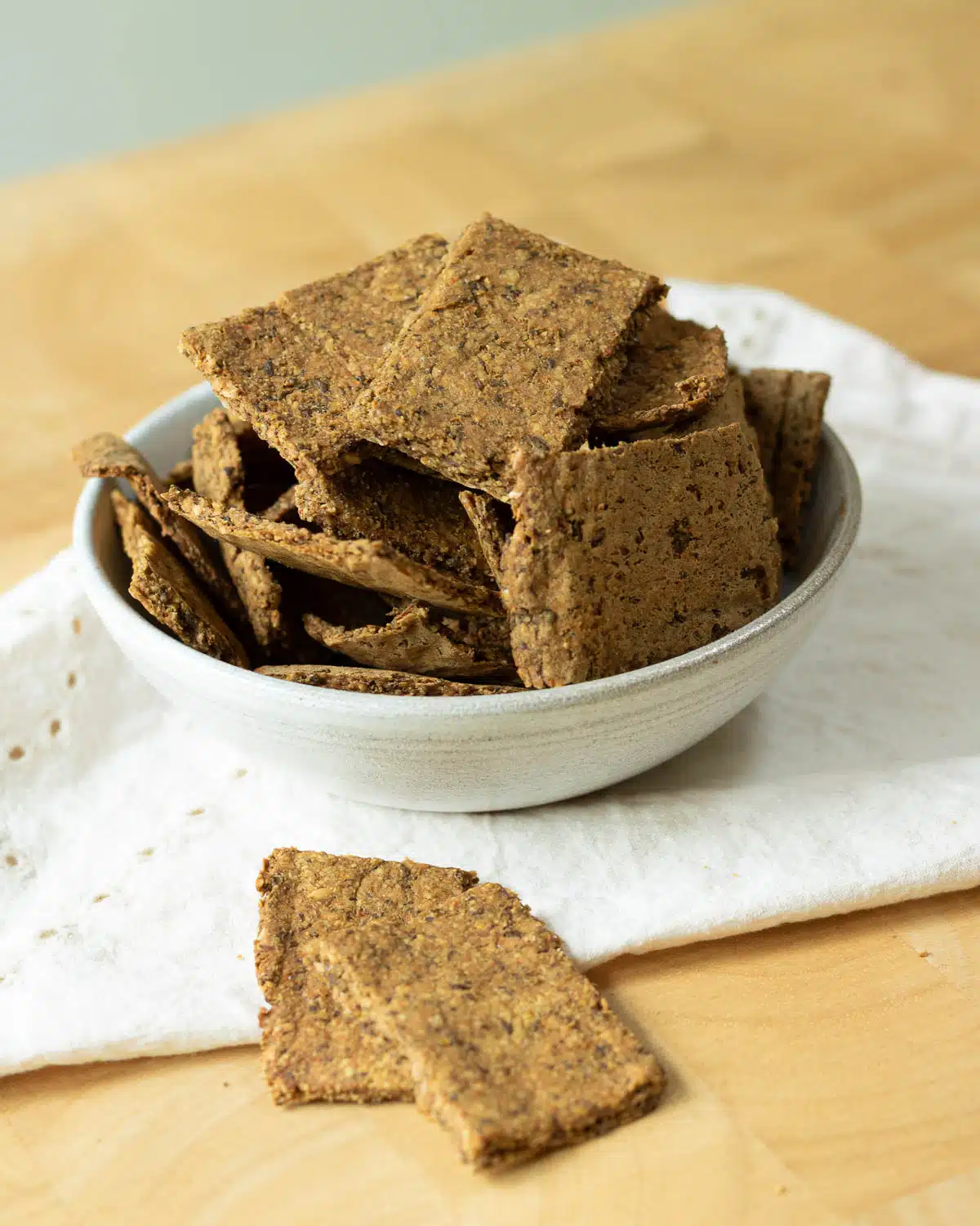 A bowl of lentil crackers on a small napkin. 