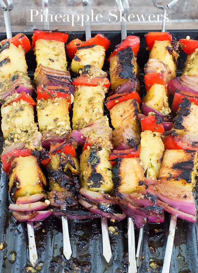 Grilled pineapple skewers with a savory crust on the bbq grill.