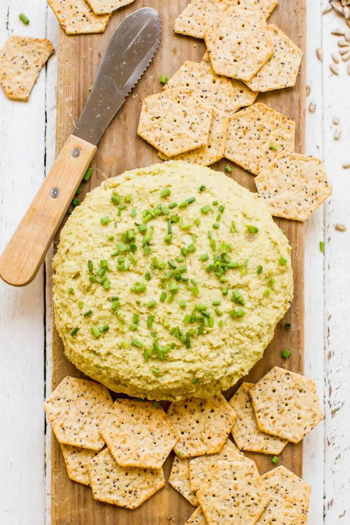 Sunflower cheese spread on a platter with some crackers