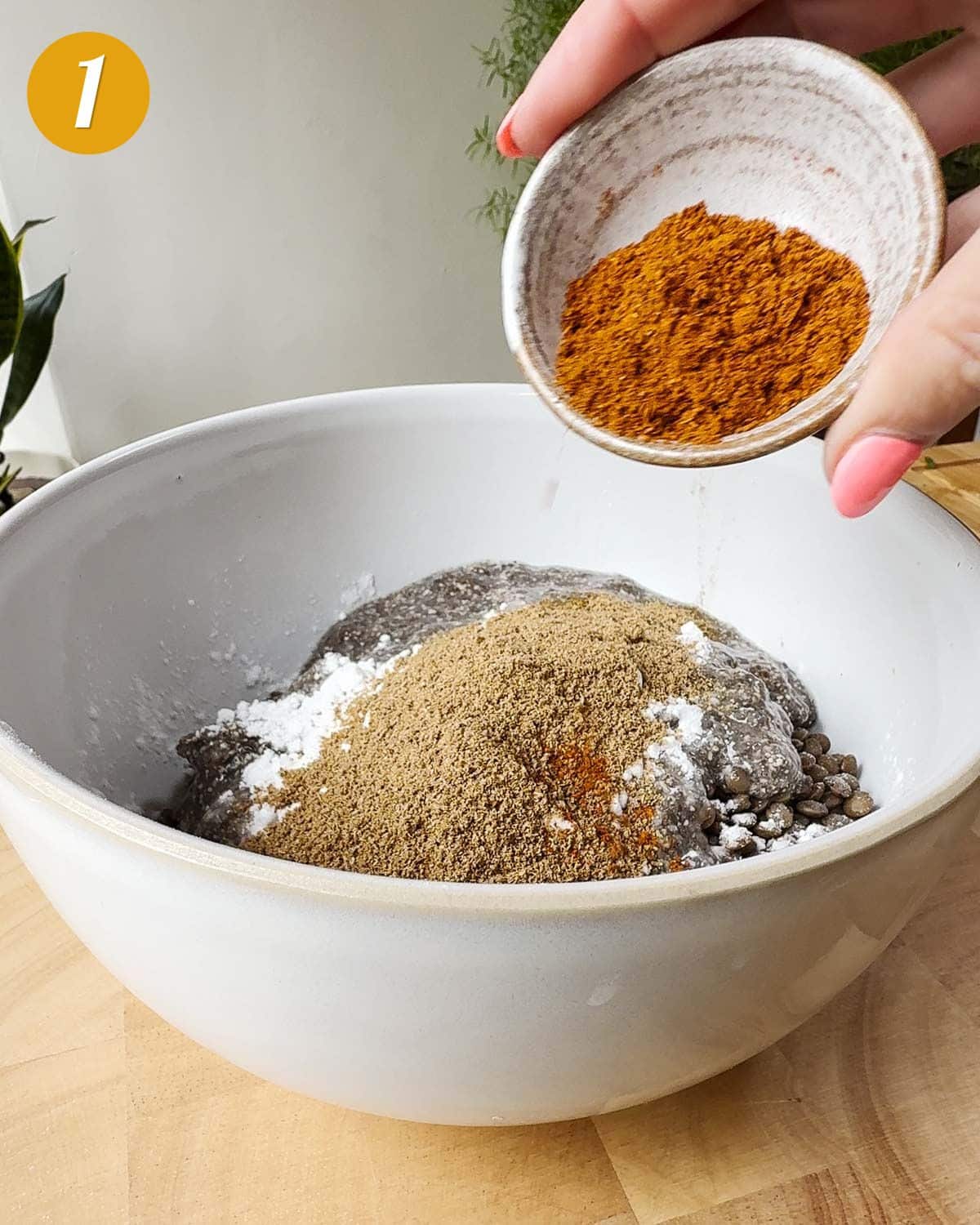 Mixing together all the ingredients for the lentil koftas.