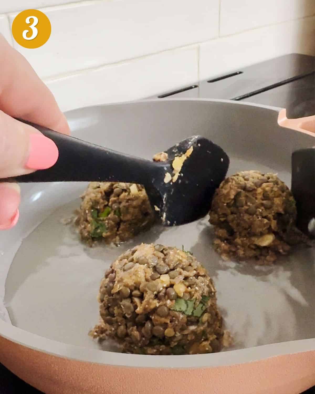 Showing how to shape the koftas in the pan when pan frying them.