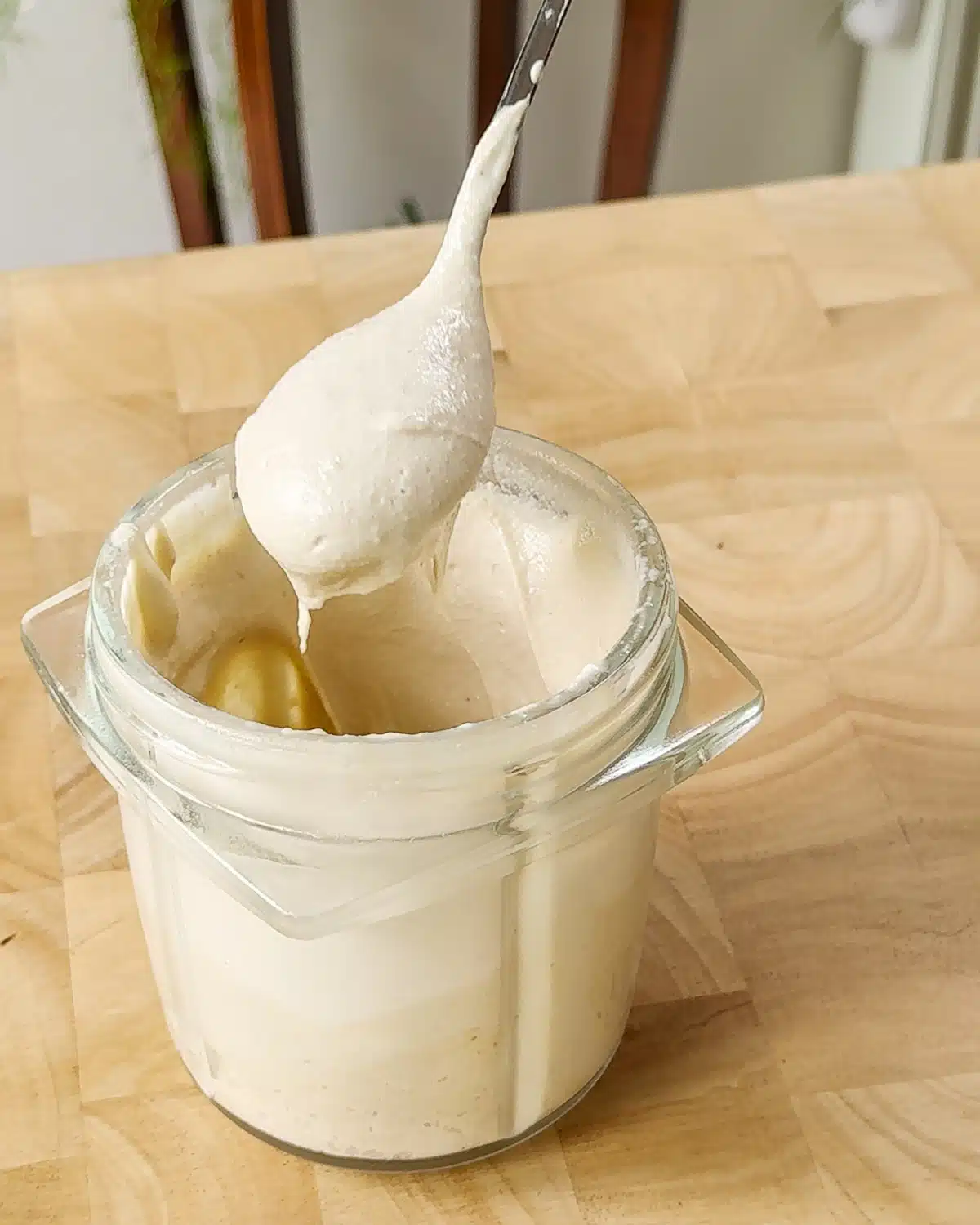 Showing the creamier textured dip once the yoghurt has been blended into it. It easily drops off a spoon but is still scoopable.