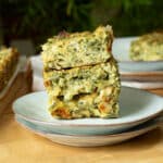 A stack of zucchini slice on a plate ready to eat.