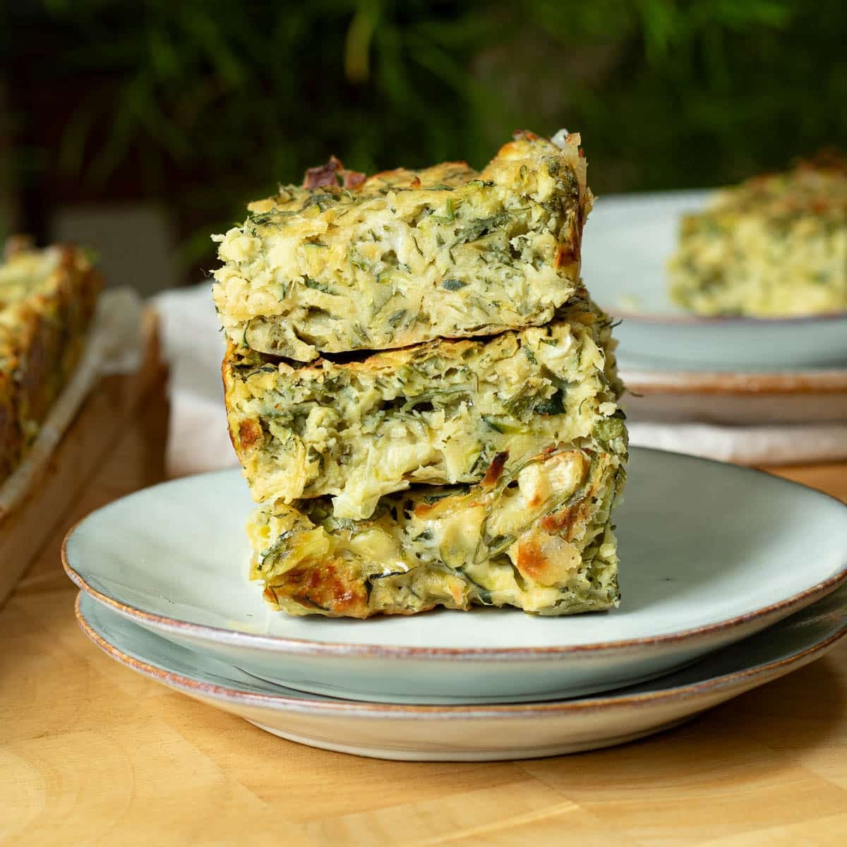 A stack of zucchini slice on a plate ready to eat.