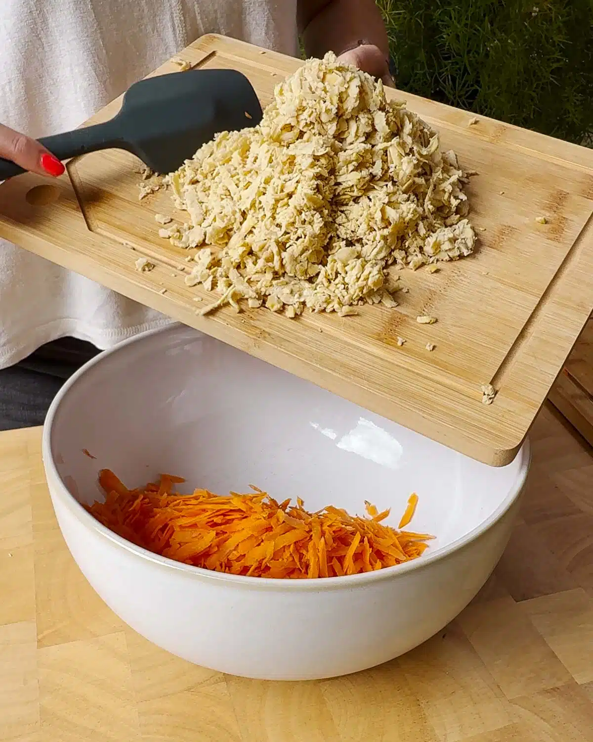 Grate Carrot and Tempeh and add to a large mixing bowl.
