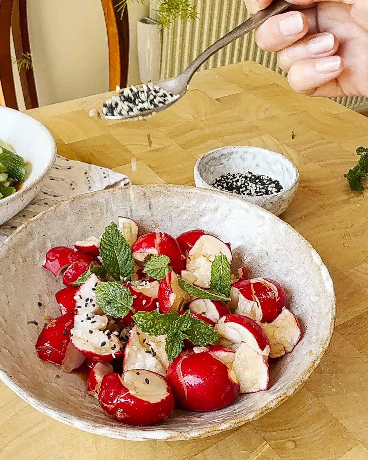 Garnish with sesame seeds and fresh herbs.
