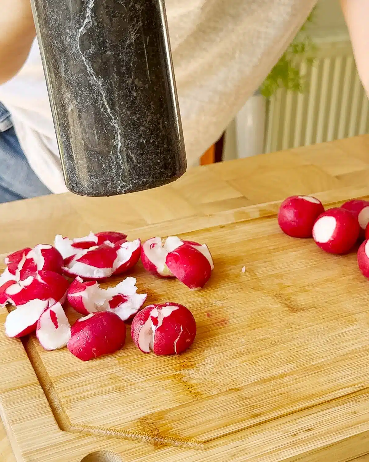 Use a feavy object like a rolling pin or clean bottle to smash the radishes.