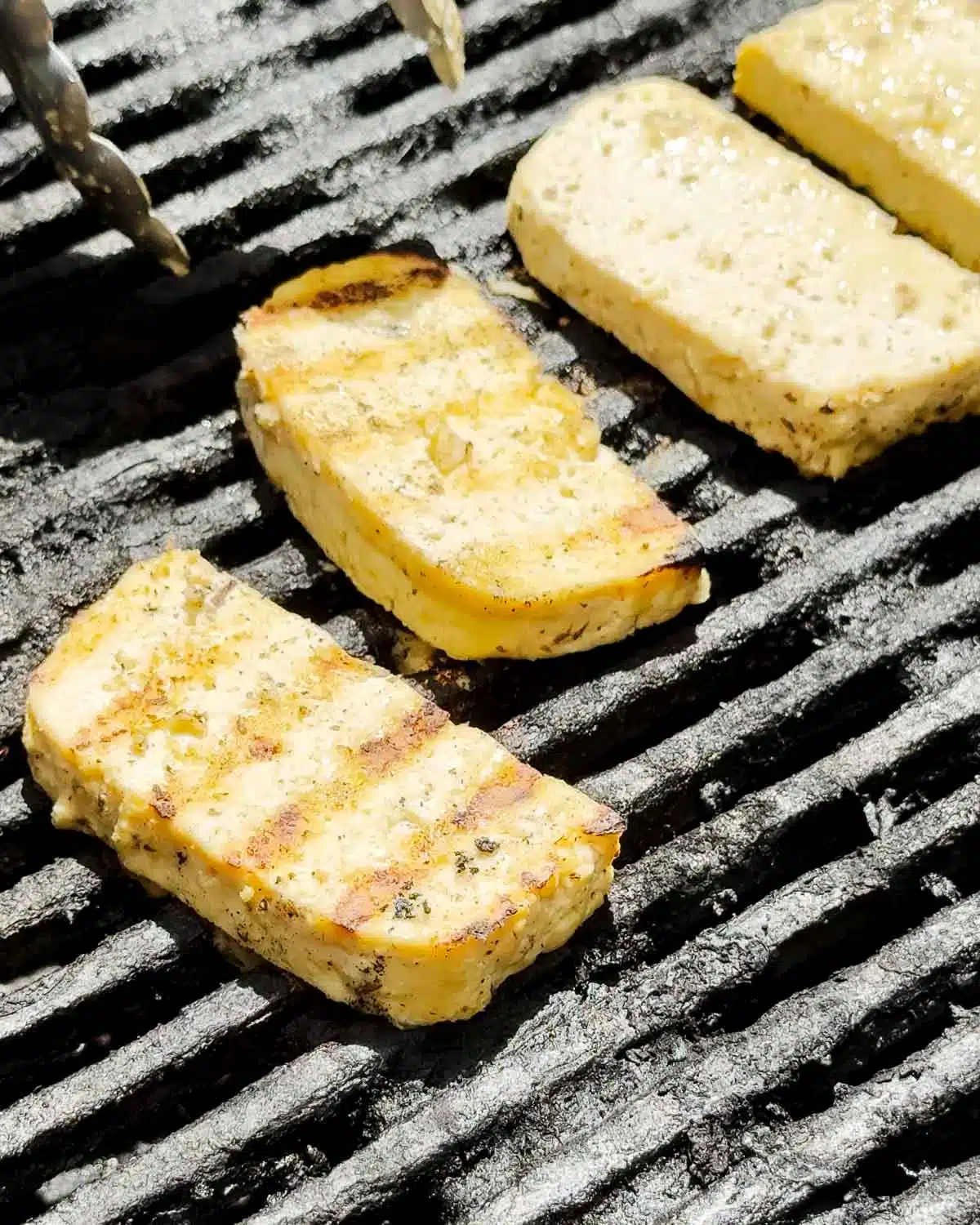 Grill, bbq or pan fry the tofu halloumi and serve hot.