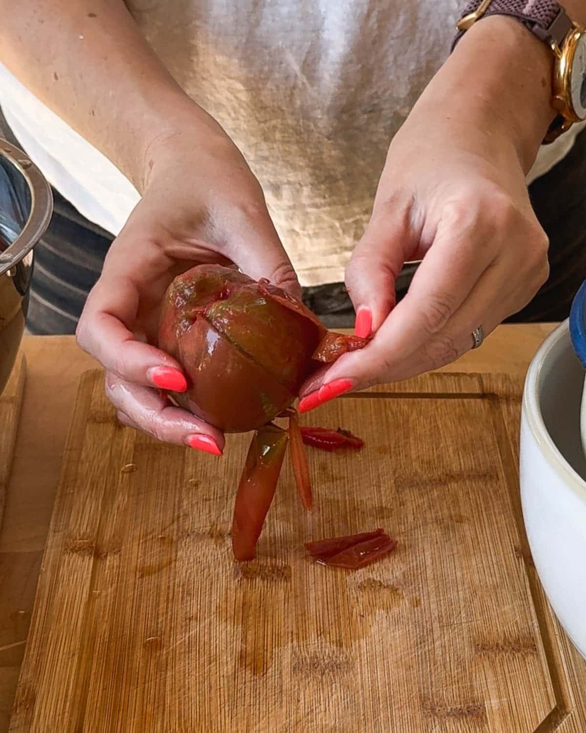Peel the skins off the tomatoes.