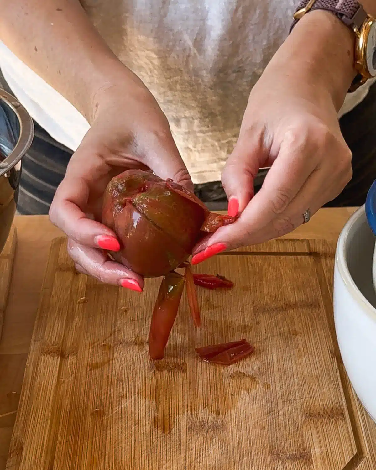 Peel the skins off the tomatoes.