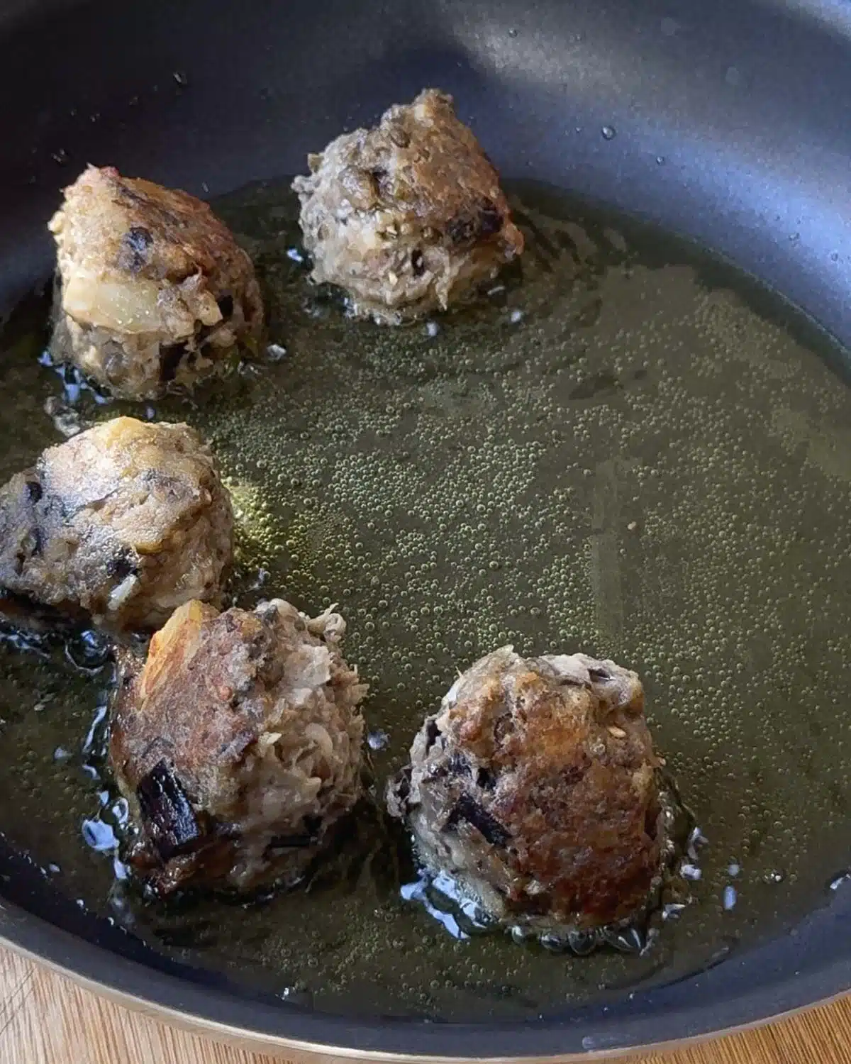 Pan Fry the lentil aubergine balls in batches until crispy or see below for oven bake instructions.