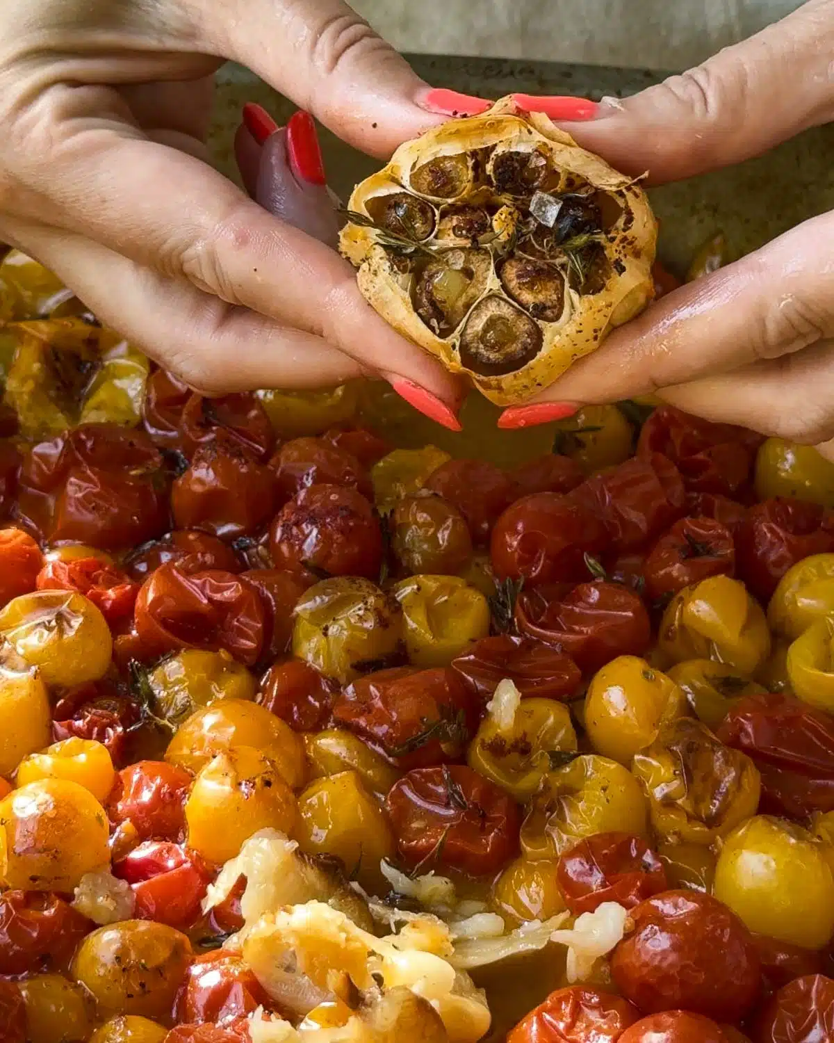 Roast until caramelised and bursting. Leave to cool, squeeze out the garlic into the tomatoes.