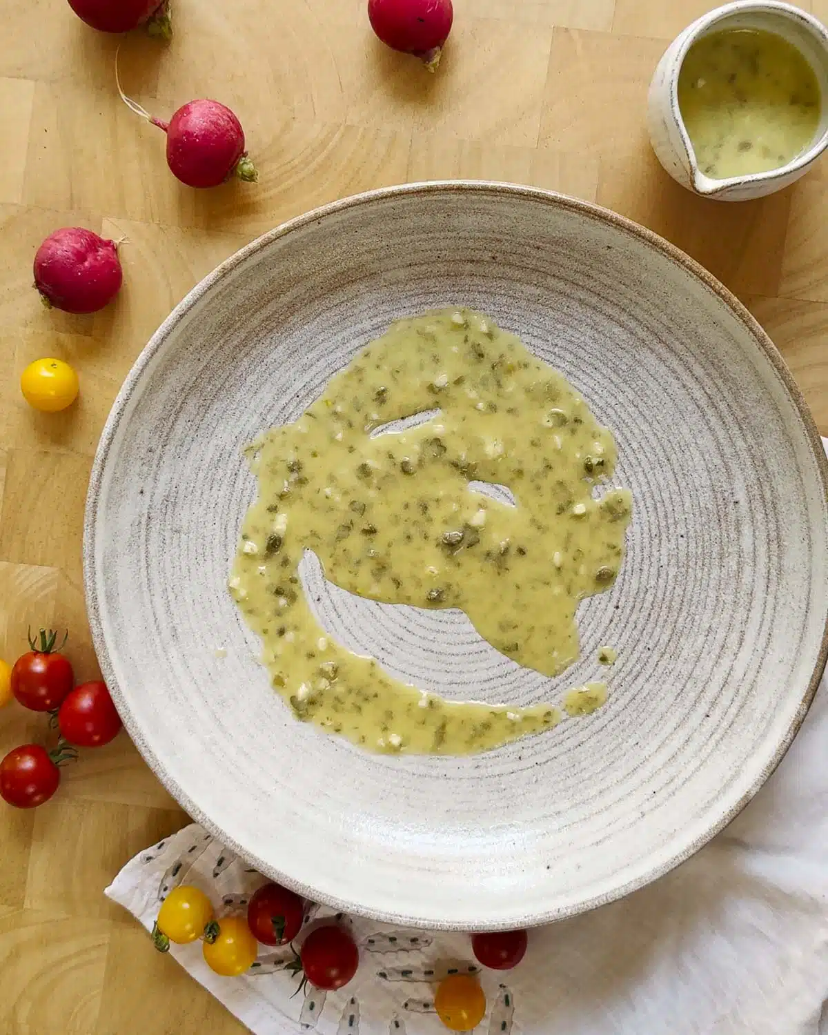 Assemble the salad in layers. Start with a generous amount of dressing on the bottom of the plate.