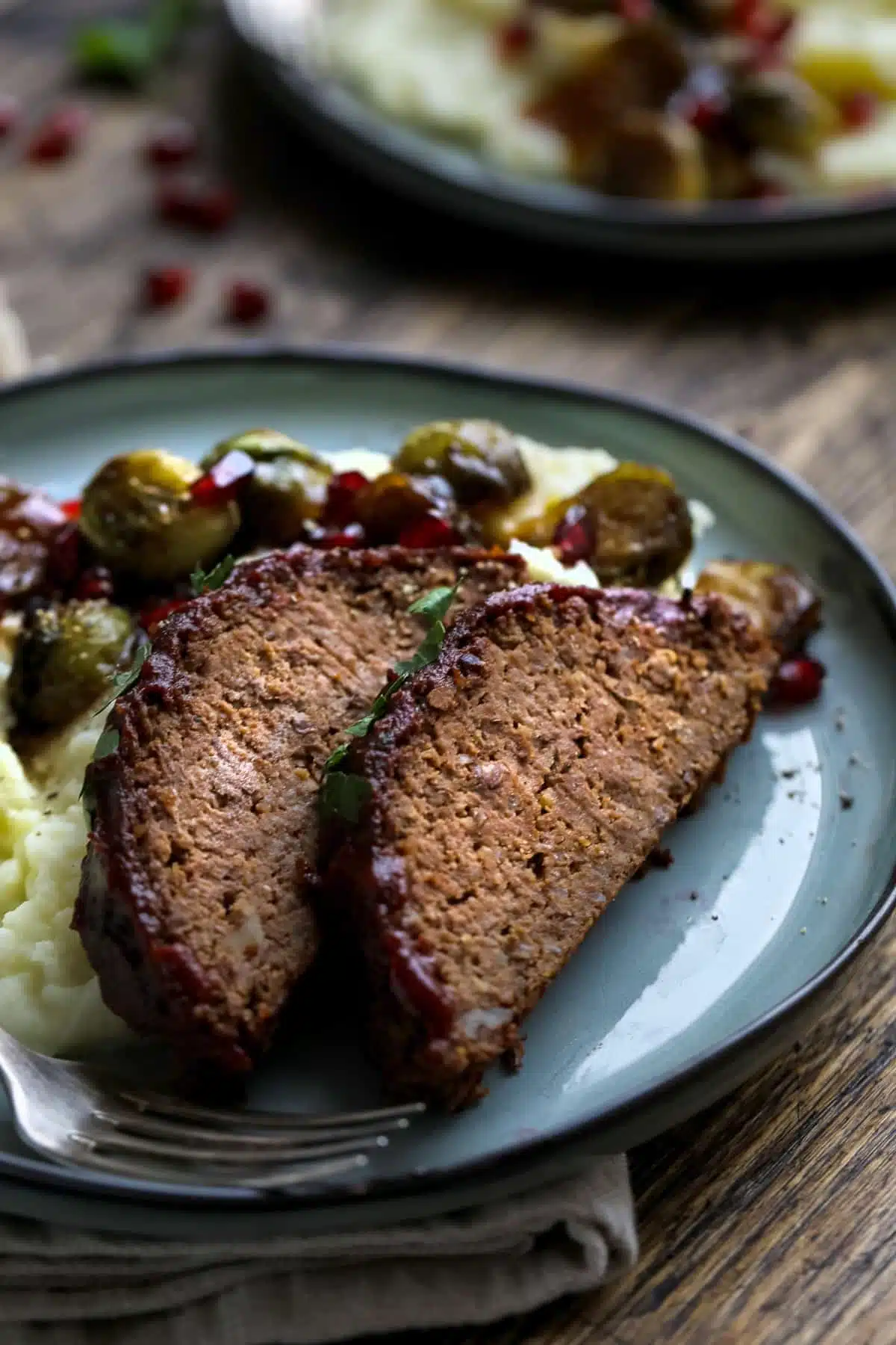 Vegan lentil and mushroom loaf sliced on a plate ready to eat.