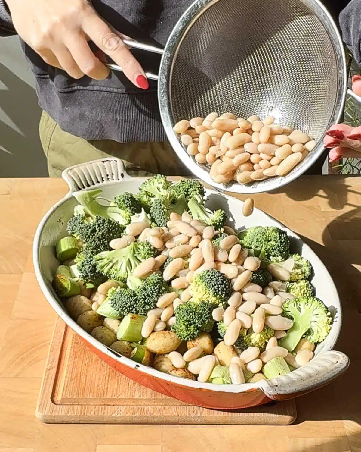 Add the chopped broccoli and optional white beans to the casserole dish. Mix.